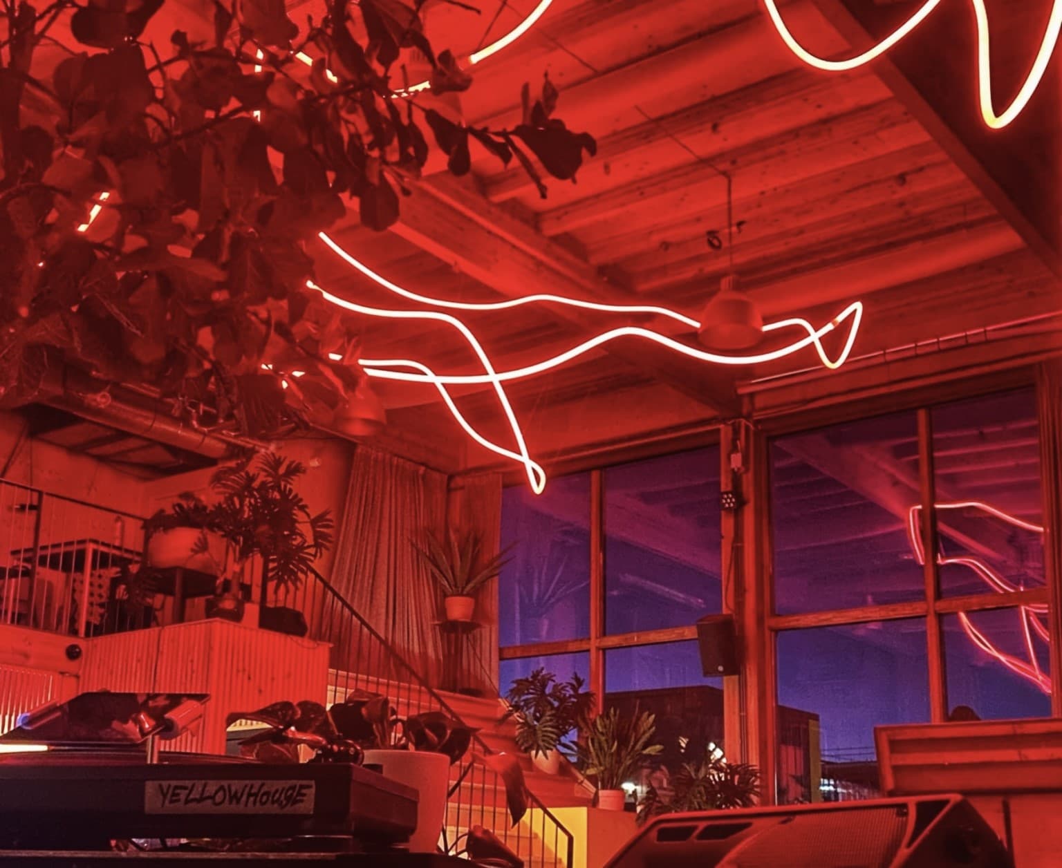 Yellowhouse interior with sculptural red and amber light defining the restaurant space